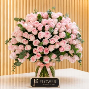 100 Pink Rose & Eucalyptus Vase arrangement featuring premium pink roses with fresh eucalyptus leaves in a clear glass cylinder vase, luxury pink roses bouquet in vase perfect for romantic gifts, gratitude, and special occasions.