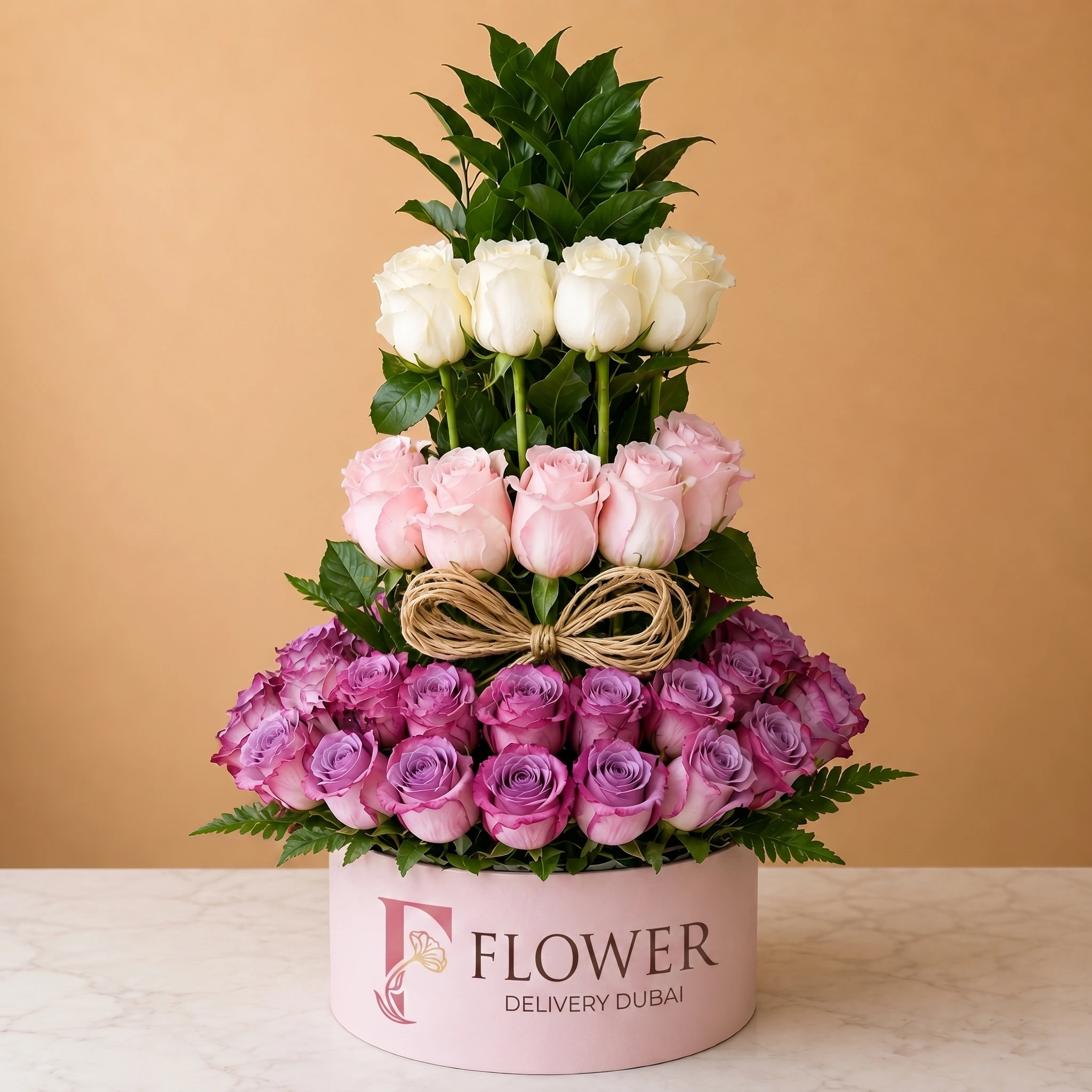 Pink, white and purple rose box featuring 20 pink roses, 20 white roses and purple roses with green fillers in a modern round gift box, luxury flower arrangement Dubai same-day delivery.