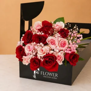 Red and pink roses arranged in a signature luxury long box, perfect for premium flower delivery Dubai surprises.